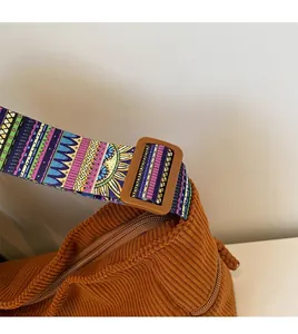Detail of caramel corduroy bag showing wide ethnic style strap and resin buckle