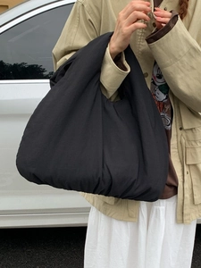 Minimalist black nylon dumpling tote bag with large capacity for casual everyday style