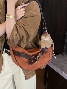 Chic leopard print crossbody hobo bag in suede finish with plush charm and buckle detail