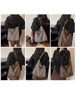 Detail showing two shades of leopard print tote bags with long brown shoulder straps