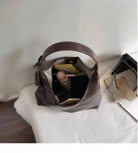 Interior view of brown leather tote showing spacious capacity for daily essentials