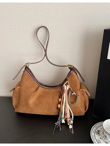 Retro brown suede hobo bag with side pockets and colorful tassel charm decoration