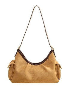 Retro camel suede shoulder bag with brown leather trim and side pockets on white background