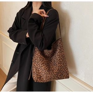 Close-up of leopard print tote bag showing premium leather texture and stitching