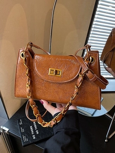 Retro brown pleated leather crossbody bag with vintage gold chain strap and buckle