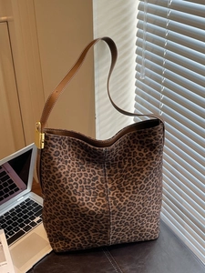 Vintage leopard print tote bag with brown leather straps and gold padlock detail