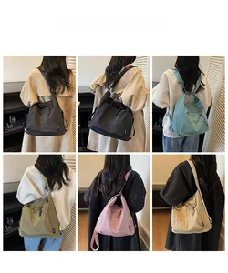 Detailed back view of a high-capacity nylon shoulder bag shown in five trendy colors