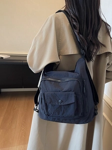 Versatile dark blue nylon crossbody tote bag with large capacity and adjustable strap