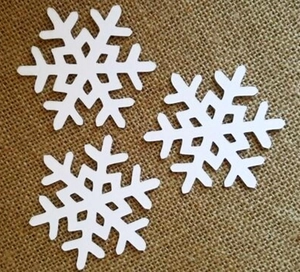 Three white laser-cut snowflake paper cards for Christmas and wedding festive decorations