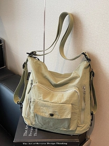 Versatile light green nylon tote bag with multi-zipper pockets for daily commuting