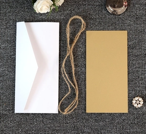 Wedding envelope invitation set with kraft card and natural twine on grey fabric