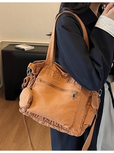 Large orange canvas tote bag with side pockets and a small coin purse for women