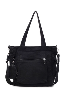 Minimalist black canvas tote bag with small coin purse and adjustable shoulder strap