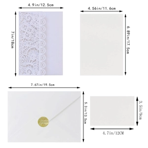 Laser-cut white lace wedding invitation set with dimensions for shell and envelopes