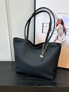 Elegant black lychee leather tote bag with gold chain and thin shoulder straps