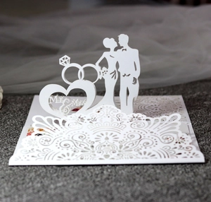 Detailed laser-cut wedding card featuring 3D Mr & Mrs heart and ring silhouettes