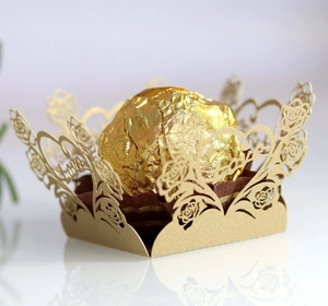 Laser cut gold favor box with hollow rose heart patterns and Love lettering for weddings