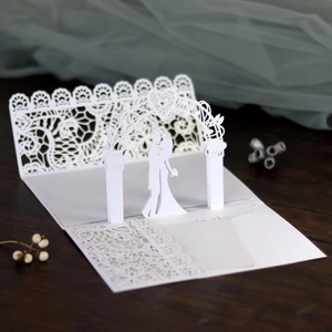 Detailed laser-cut white 3D pop-up wedding invitation card with lace floral patterns