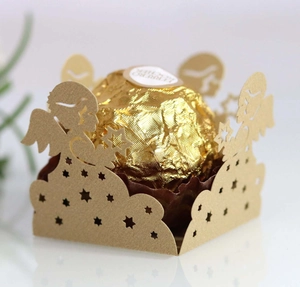 Detailed laser-cut gold wedding favor box featuring angel and star hollow patterns