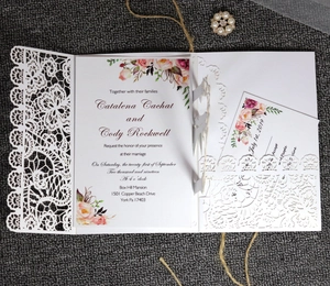 Detailed laser-cut lace wedding invitation set with floral inner cards and RSVP card