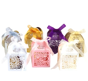 Elegant laser-cut hollow heart candy boxes with ribbons for wedding and party favors