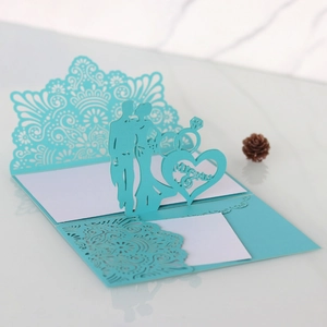 Detail showing 3D laser-cut wedding invitation with Mr & Mrs text in Tiffany Blue