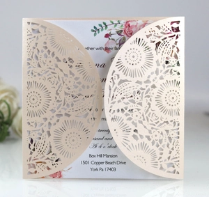 Detailed laser cut floral invitation card with pearl finish and watercolor insert