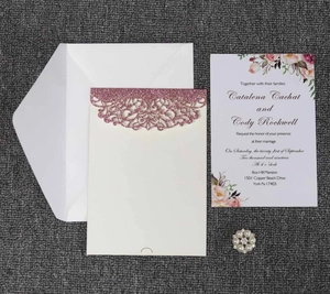 Elegant laser cut wedding invitation set with rose gold glitter pockets and floral design