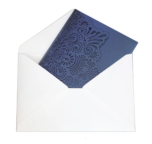 Detailed laser-cut navy blue wedding invitation card with floral hollow pattern and white envelope