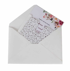 White laser cut lace wedding invitation set with floral inner card and envelope