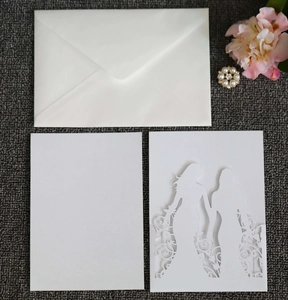 Laser-cut wedding invitation featuring female couple silhouette and floral patterns