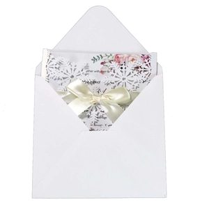 Elegant white laser cut wedding invitation card with snowflake pattern and pink flowers