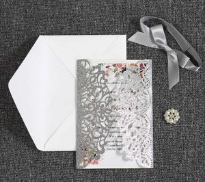 Detailed laser cut pocket with glitter silver finish and flower pattern insert card