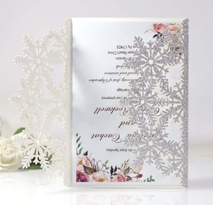 Elegant laser cut snowflake wedding invitation with silver glitter and floral print