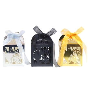 Laser cut Halloween candy boxes with spider web patterns in gold silver and black colors