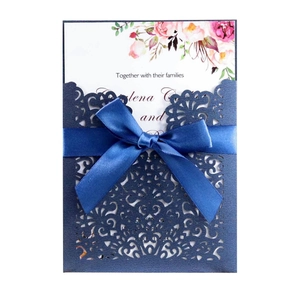 Laser cut navy wedding invitation with satin ribbon and floral insert card detail
