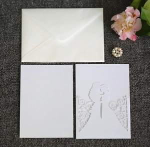 Laser cut wedding invitation set with couple silhouette and white floral envelopes