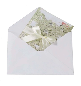 Elegant white laser cut snowflake wedding invitation with glitter gold cover and ribbon