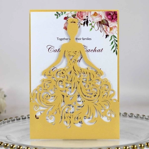 Laser cut wedding invitation with golden princess gown design and floral insert