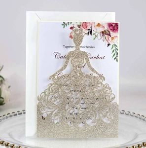 Detail of laser cut gold glitter wedding invitation with female silhouette and floral insert