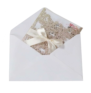 Detailed set of glitter snowflake laser-cut cards with cream ribbon and floral inner