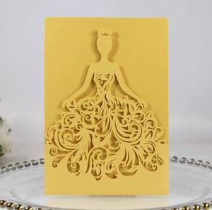 Detailed laser-cut yellow wedding invitation featuring an elegant girl silhouette design