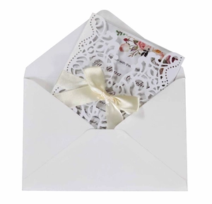 Elegant white laser cut wedding invitation with ribbon and floral insert set
