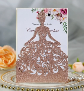 Detail of rose gold glitter laser cut invitation featuring a 3D bridal gown design