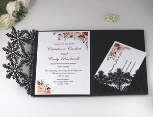 Detailed laser-cut snowflake wedding invitation set with floral card and RSVP card