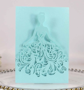 Detailed laser-cut light blue wedding invitation featuring a female silhouette with scrollwork