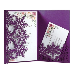 Detailed laser-cut purple snowflake wedding invitation set with floral card and RSVP card