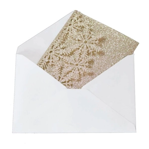 Champagne gold glitter laser-cut snowflake greeting card with a white envelope