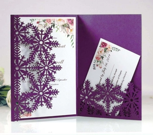 Detail of laser cut purple snowflake invitation set with inner card and RSVP card