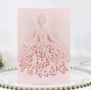 Detail of pink laser-cut greeting card featuring an elegant dress silhouette with floral patterns